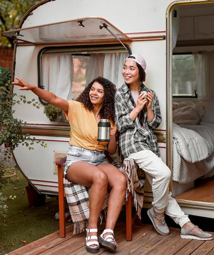 Two people exploring Africa with a camper van.